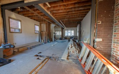 Open concept renovation at residential house in Toronto, Ontario. On the floor are visible tools and wood supply.